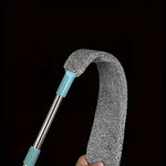 Cepillo extensible para limpieza de sofás